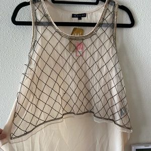 Transparent and beaded shirt